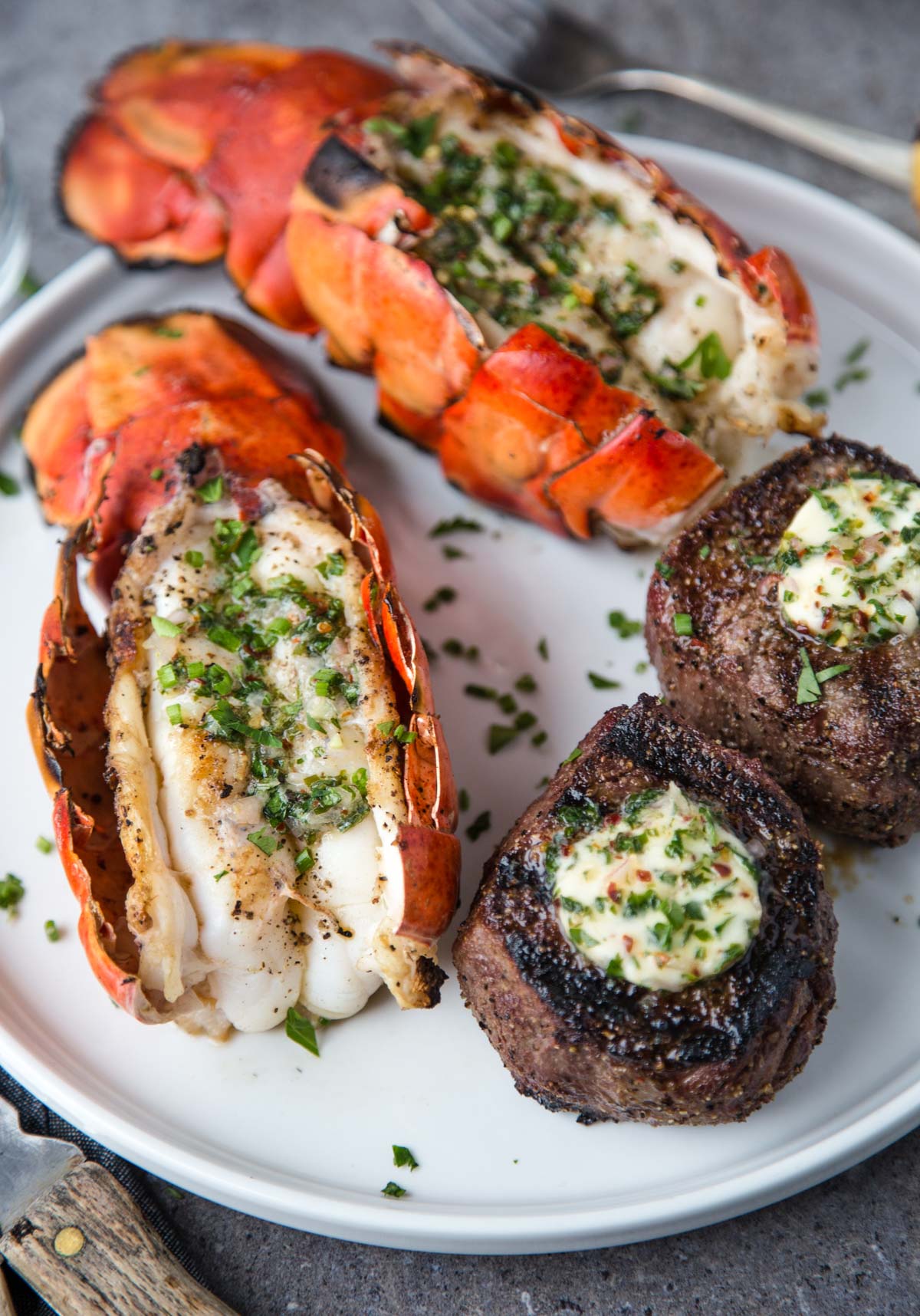 Grilled Surf and Turf (Grilled Lobster Tails and Filet Mignon) on a serving platter