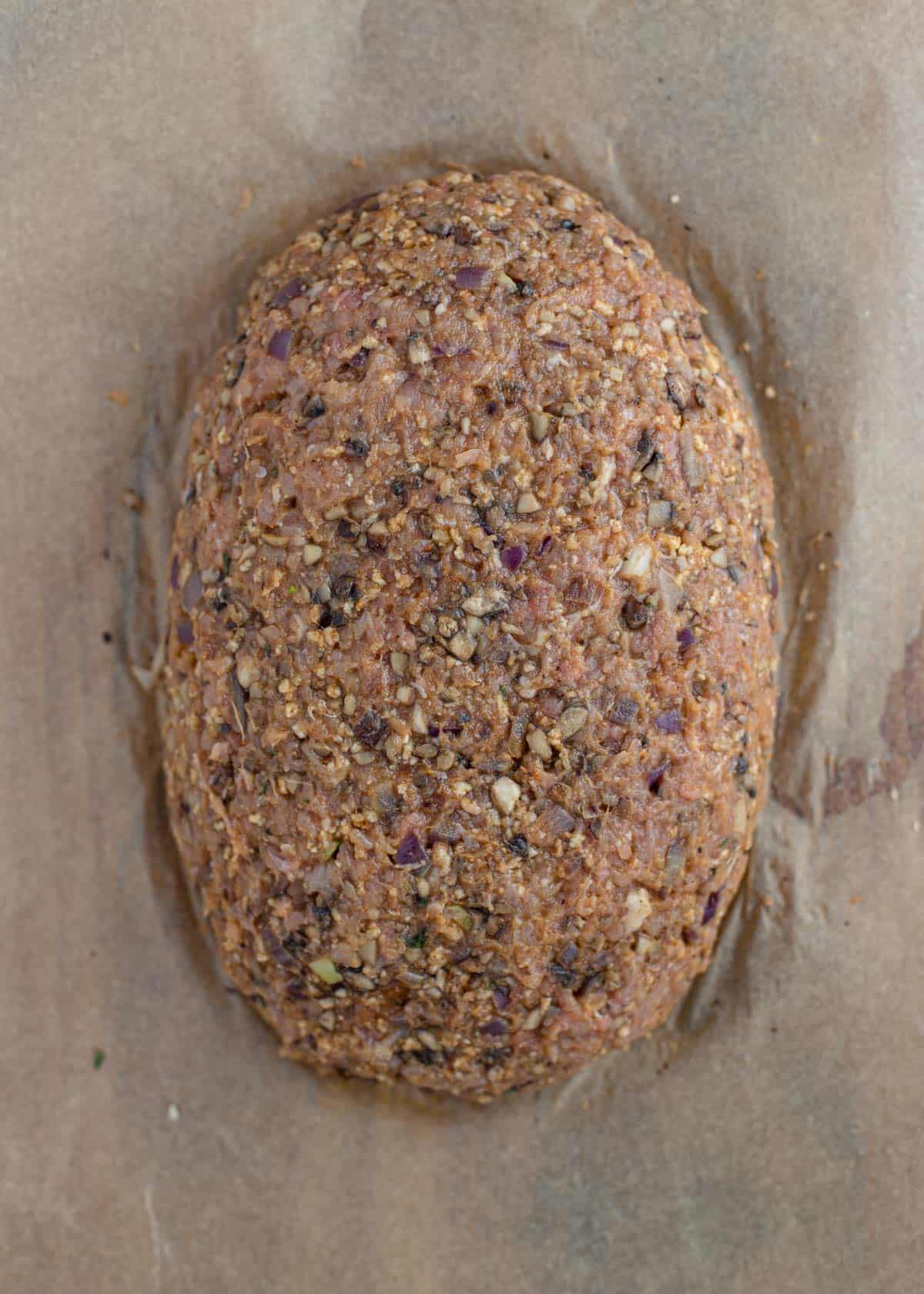 Turkey meatloaf formed into a loaf.