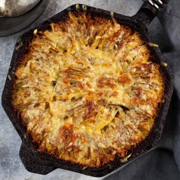 Hasselback style potatoes in a Finex cast iron pan.