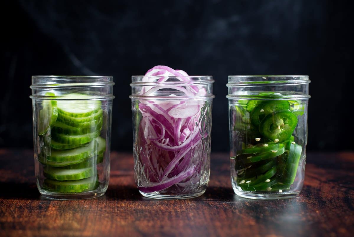 Vegetables in mason jars preparing for brining