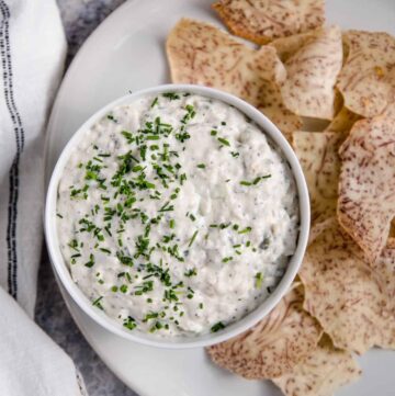 Smoked fish dip in a bowl with taro chips.