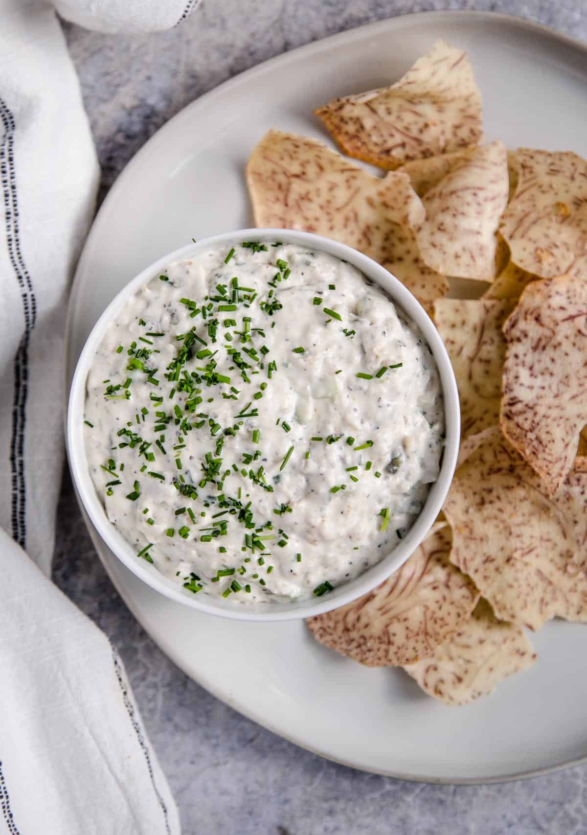Smoked fish dip in a bowl with taro chips