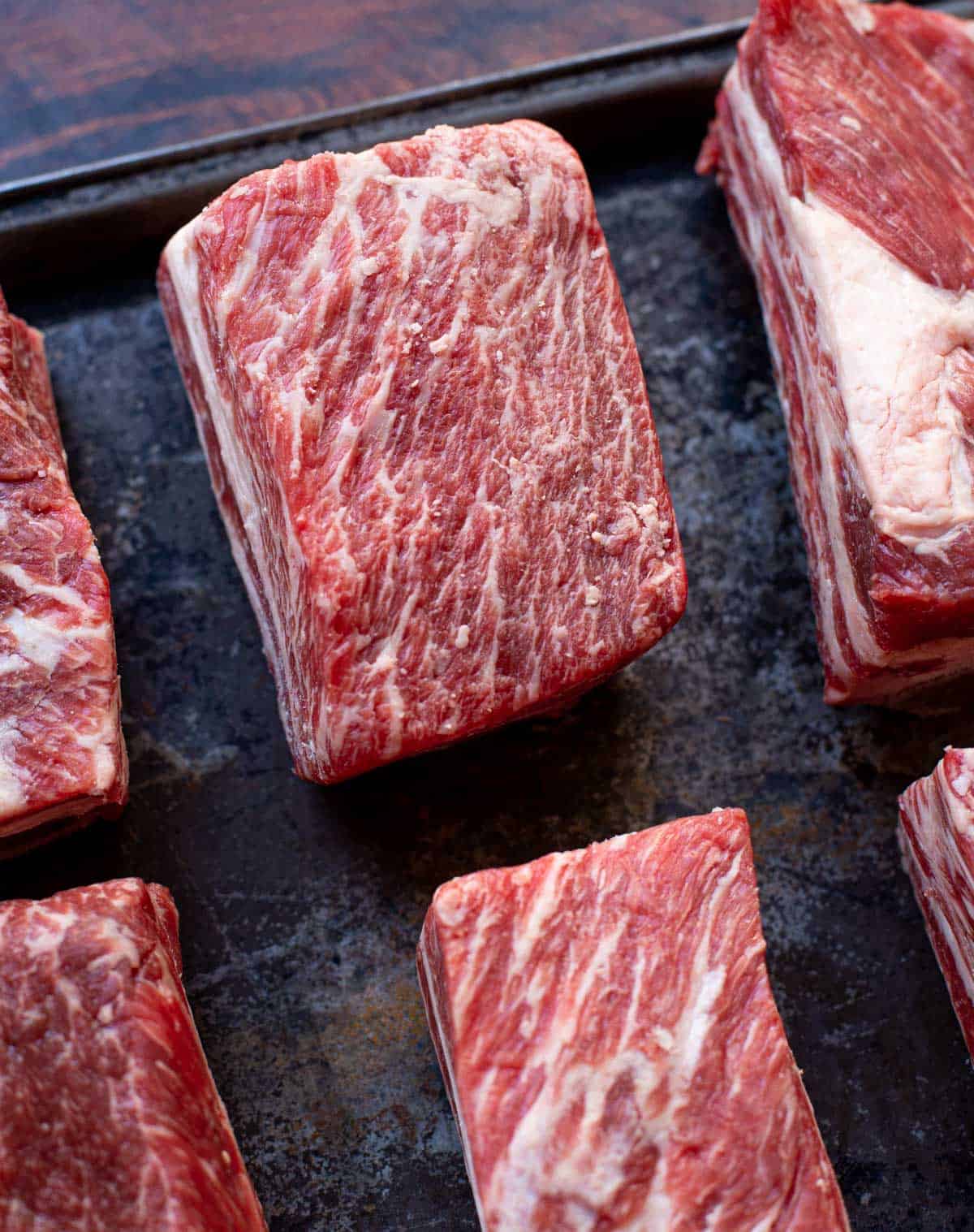 Raw and trimmed beef short ribs.