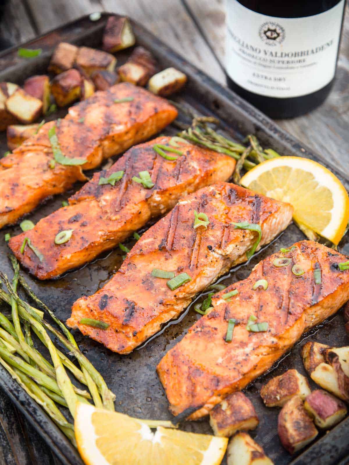 Grilled salmon filets on a pan.