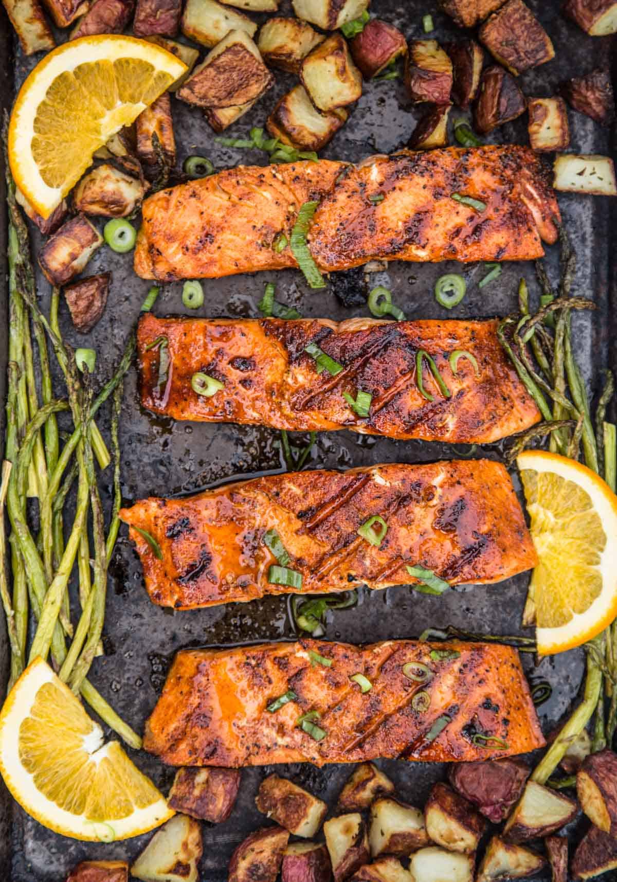 Grilled Salmon with a Sweet Orange Maple Glaze on a sheet pan with grilled asparagus and potatoes