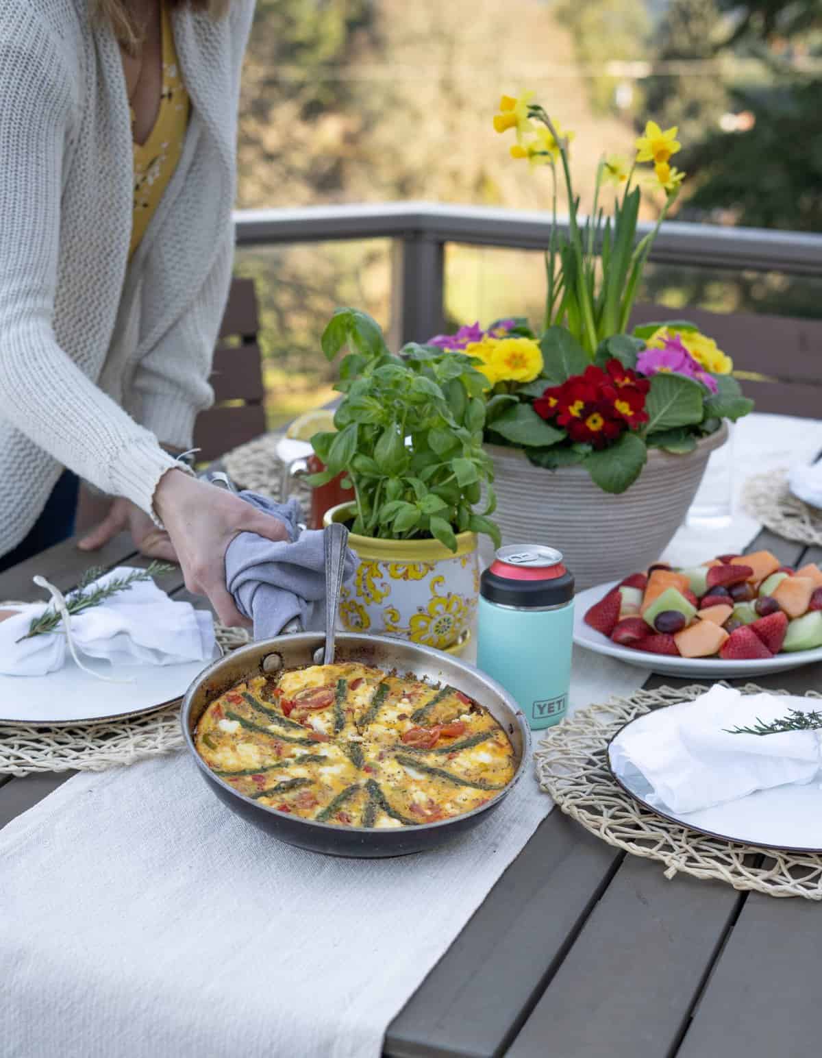 A woman serving Easter recipes outdoors
