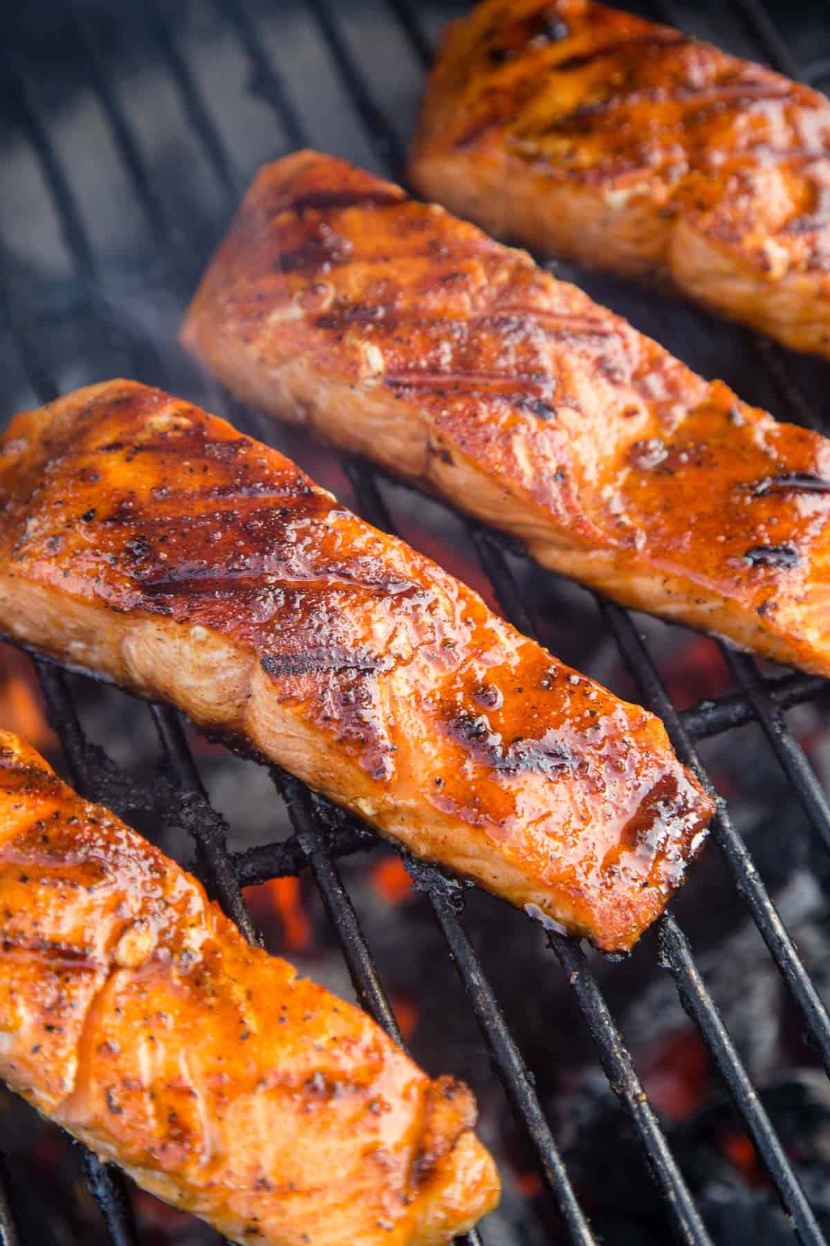 Four salmon filets on the grill