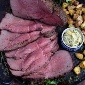 Smoked sirloin roast beef slices on a serving tray.