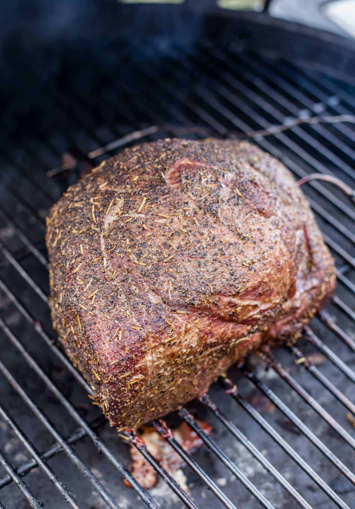 Smoked beef roast cooking on a big green egg smoker