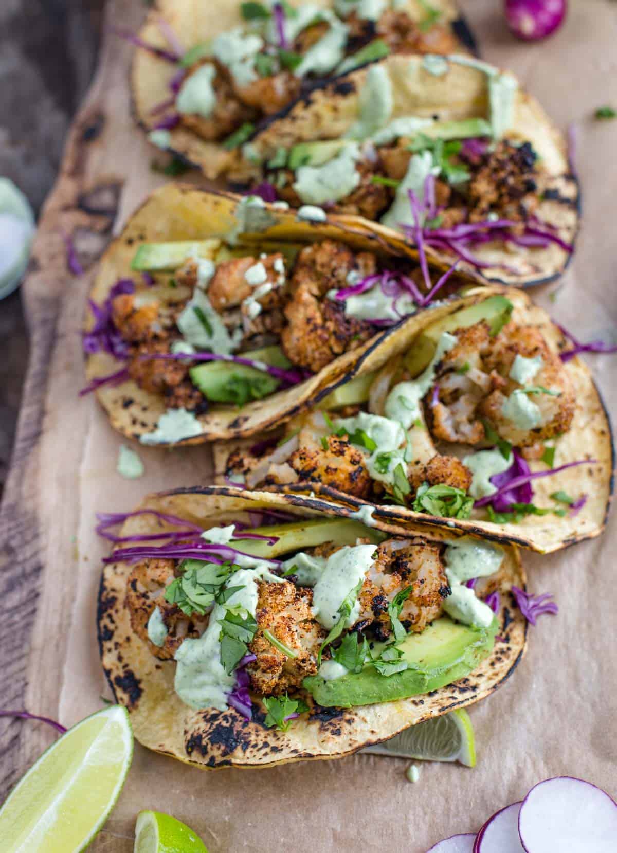 Grilled Cauliflower Tacos topped with an avocado cream