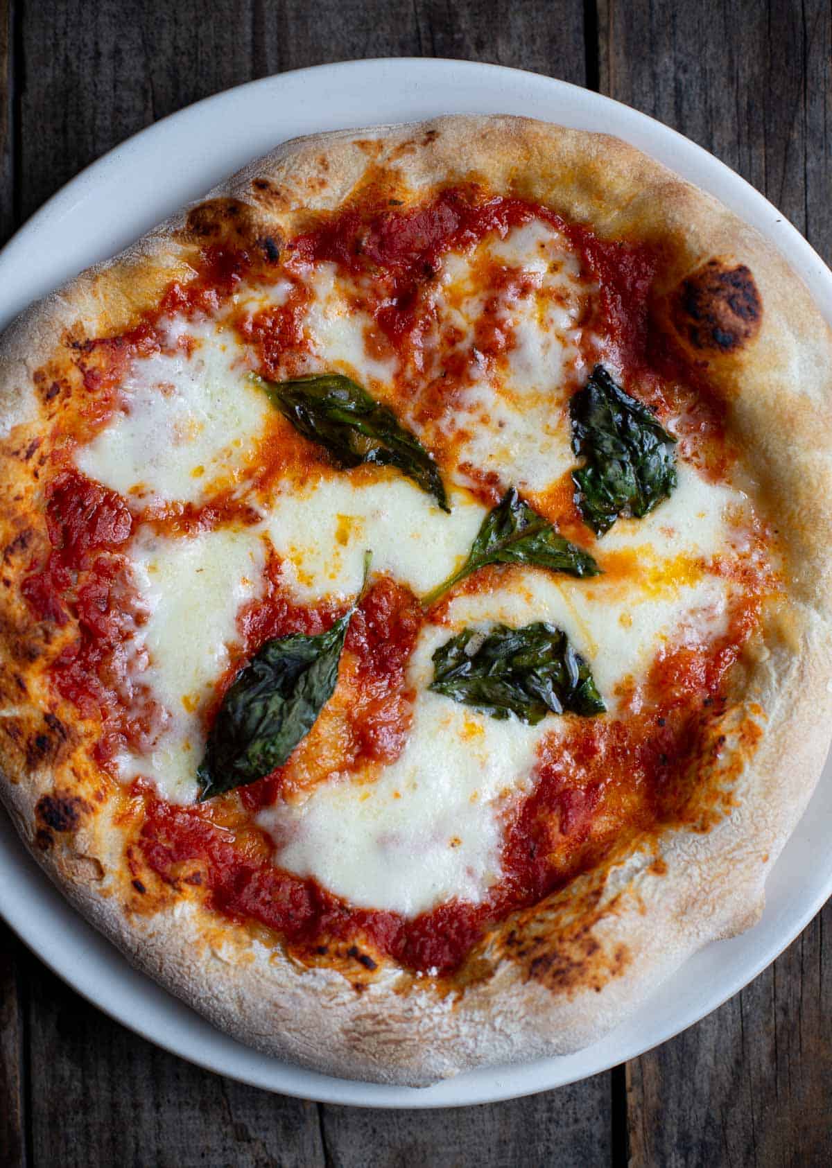 Cooked Margherita Pizza on a white plate