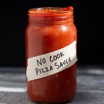 Homemade no cook pizza sauce in a mason jar.