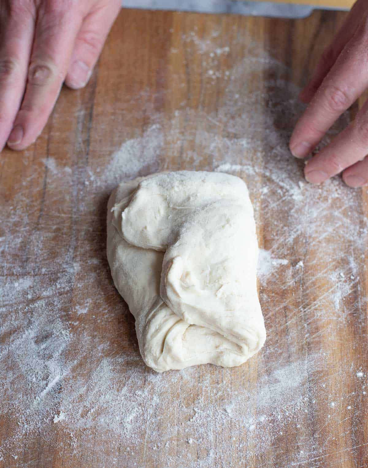 Folding a single pizza dough