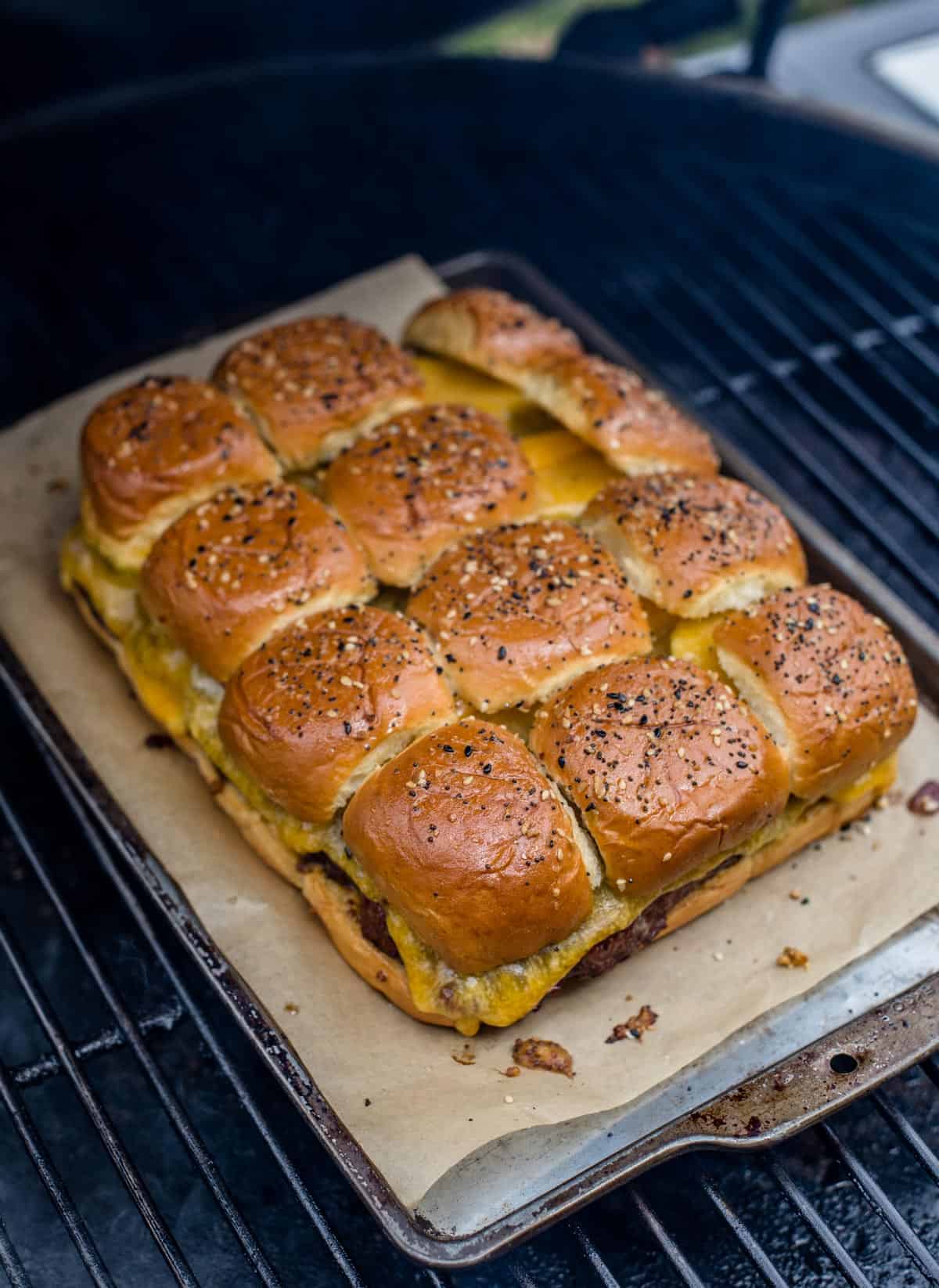 Grilling cheeseburger sliders on a Big Green Egg.