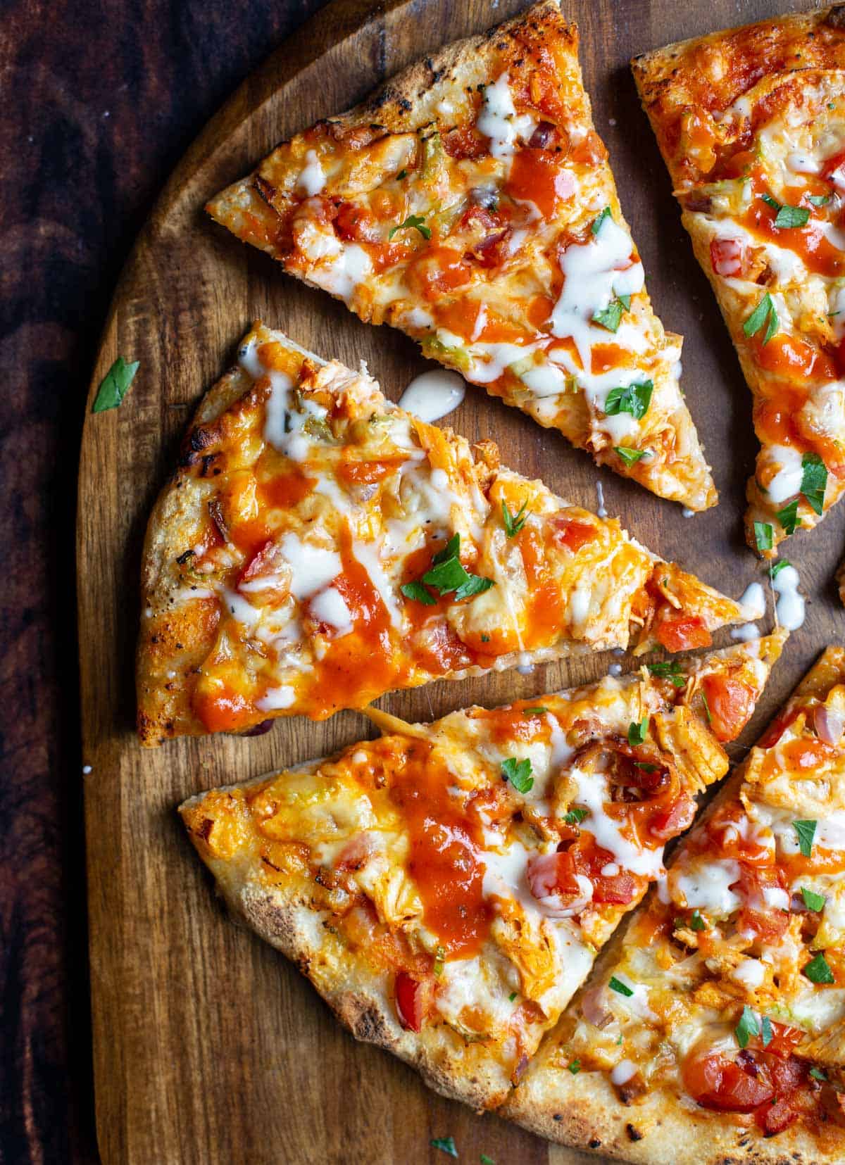 Smoked Buffalo Chicken Pizza on a pizza peel.