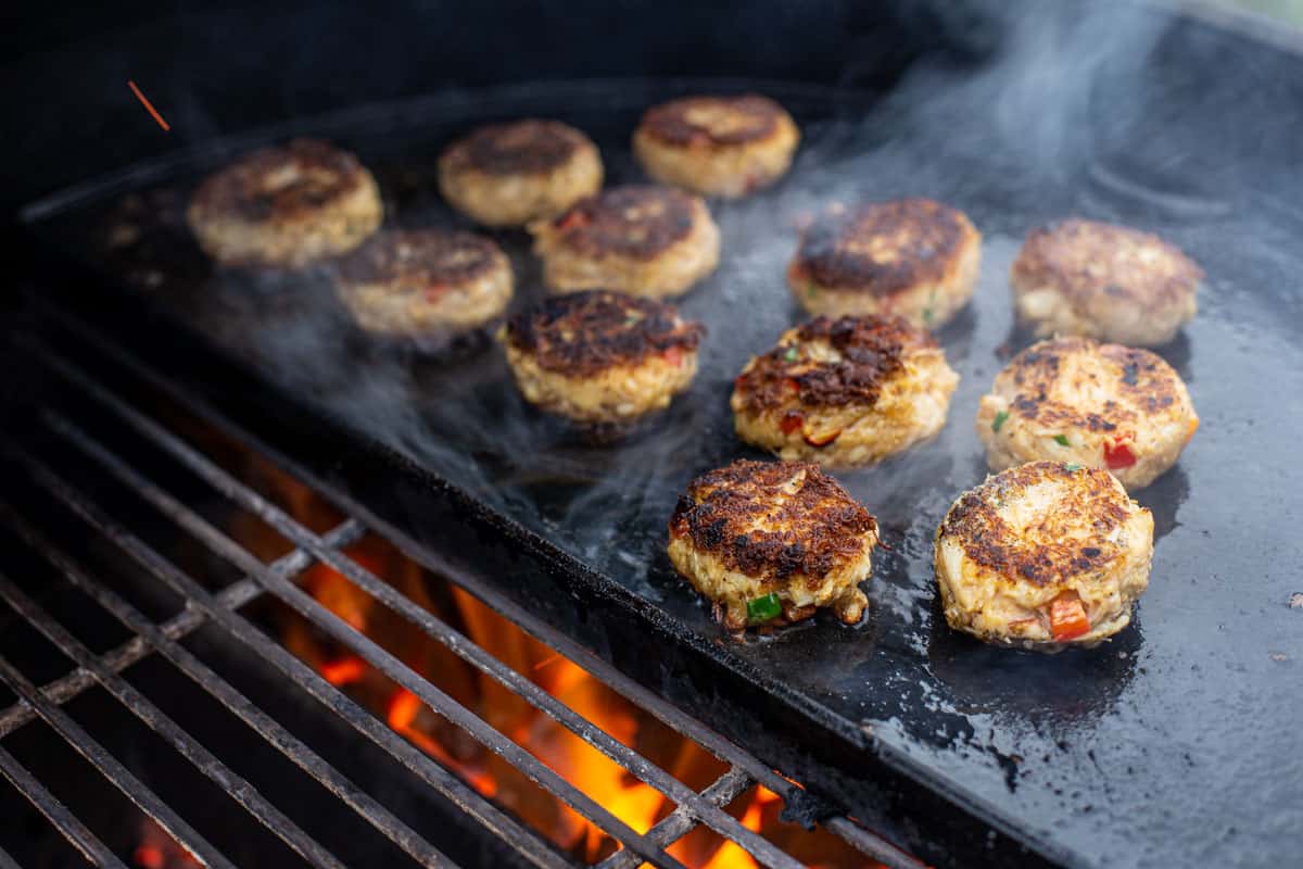 Grilled Salmon and Crab cakes on a plancha on a Big Green Egg.