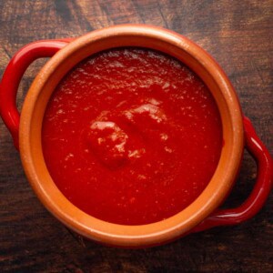 Red chile sauce in a dish.