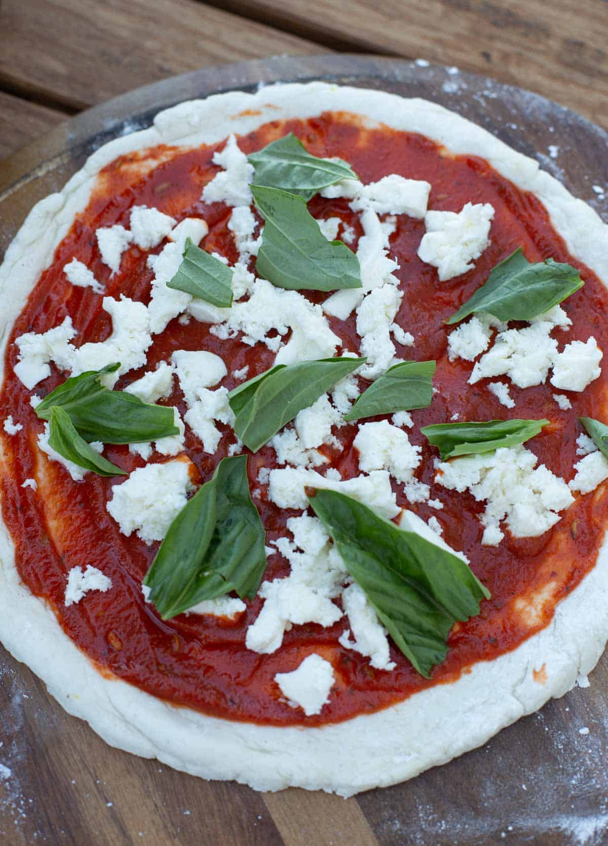 Gluten free margherita pizza before being cooked.