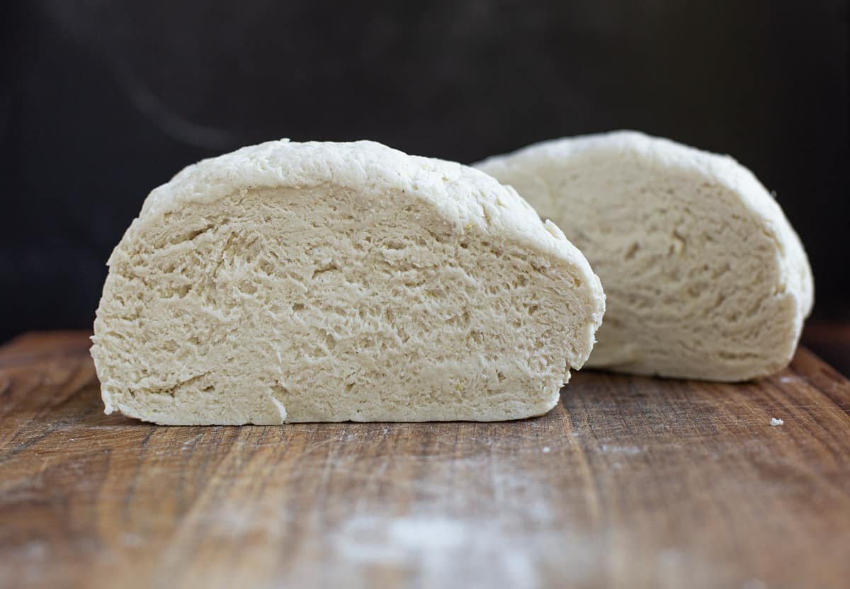 Gluten free dough cut in half showing air bubbles.