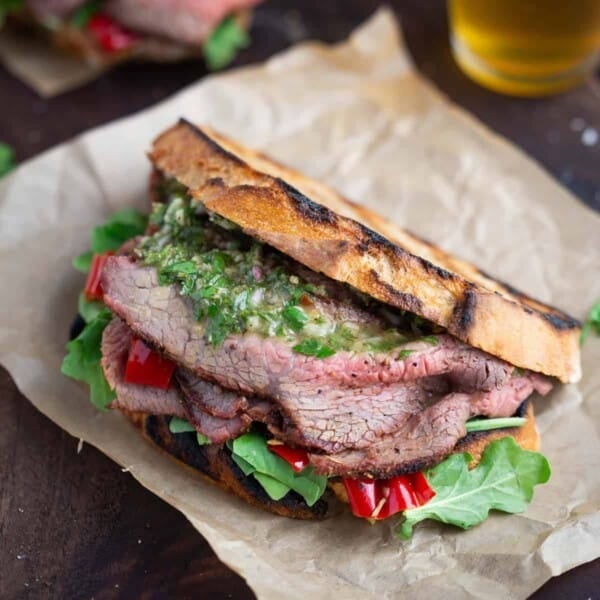 tri tip sandwich on a cutting board.