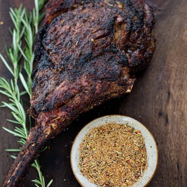 Beef seasoning with a Grilled Tomahawk Steak on a cutting board.