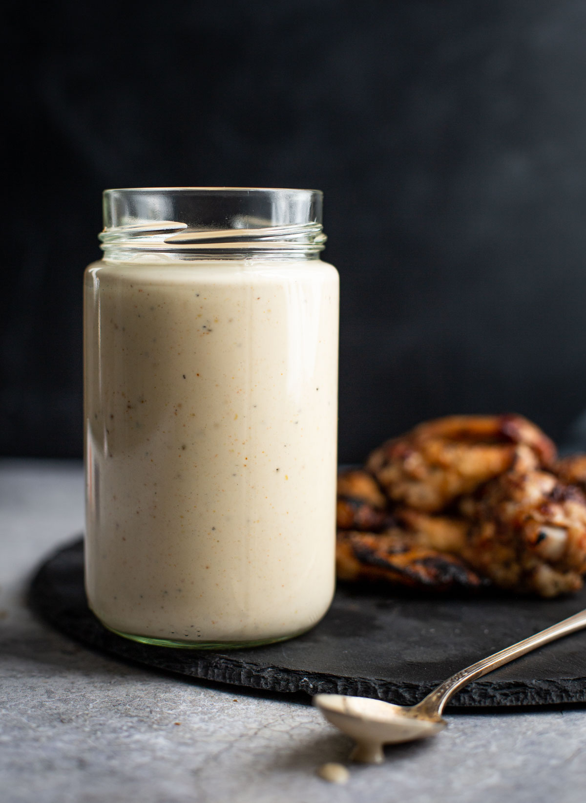 Alabama White Sauce in a glass jar.