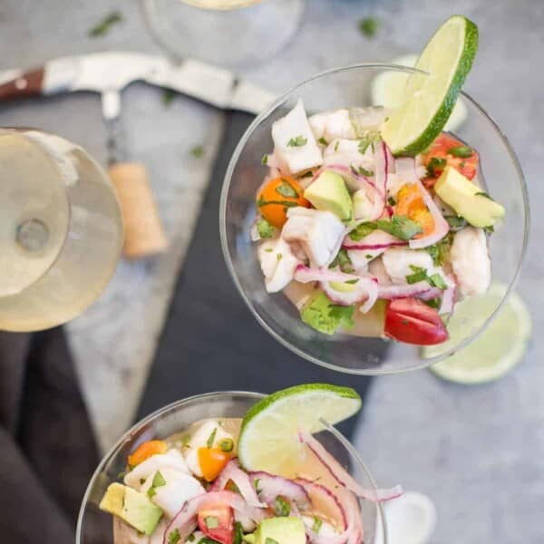 White fish ceviche in a martini glass and wine.