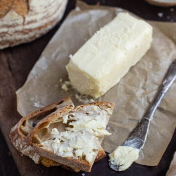 Smoked Butter on a serving plate with bread.