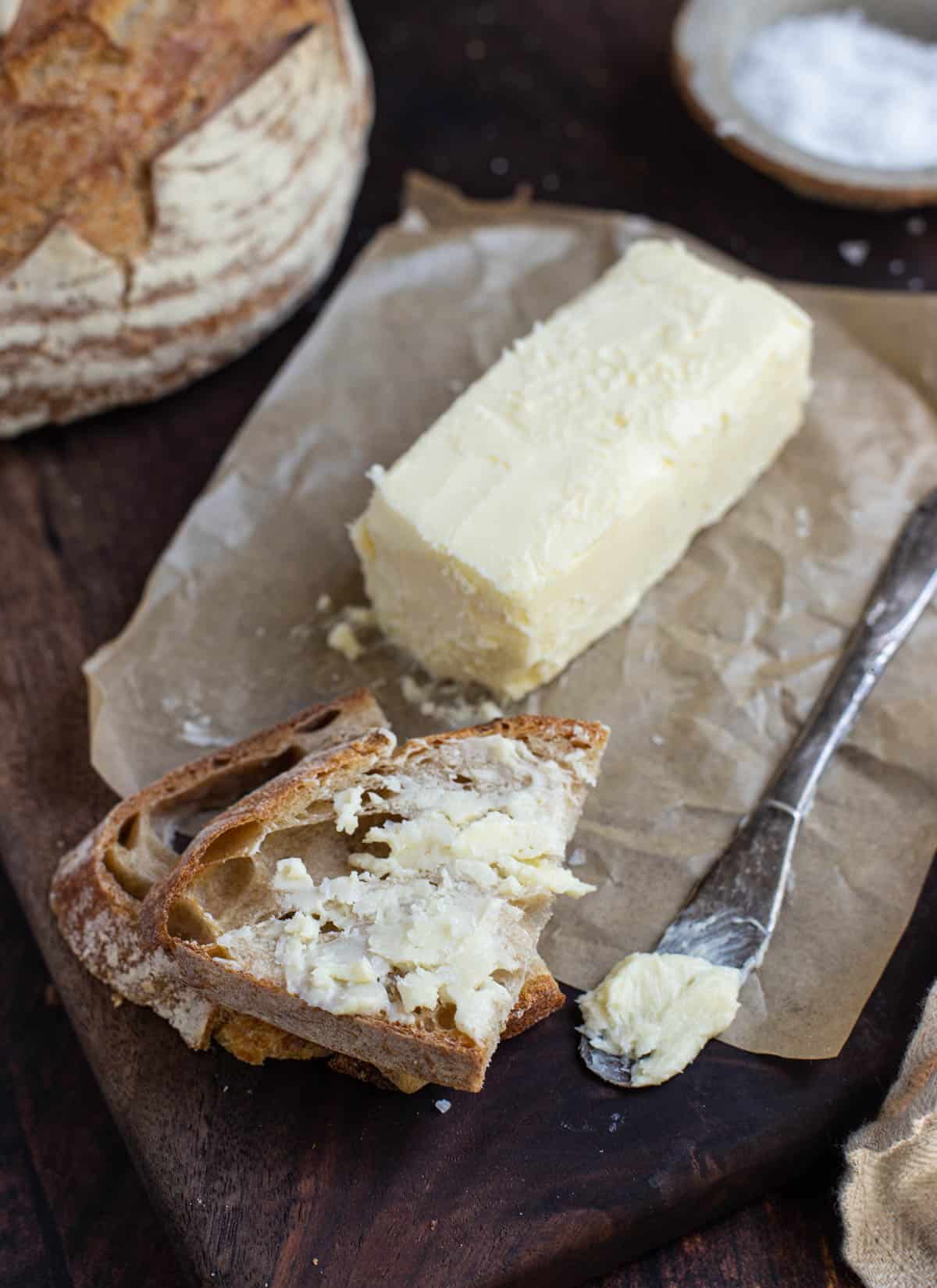 Smoked Butter on a serving plate with bread.