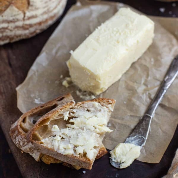 Smoked butter with bread on tray.