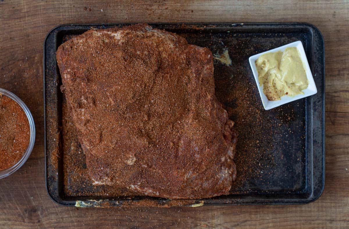 A seasoned bone-in pork butt.