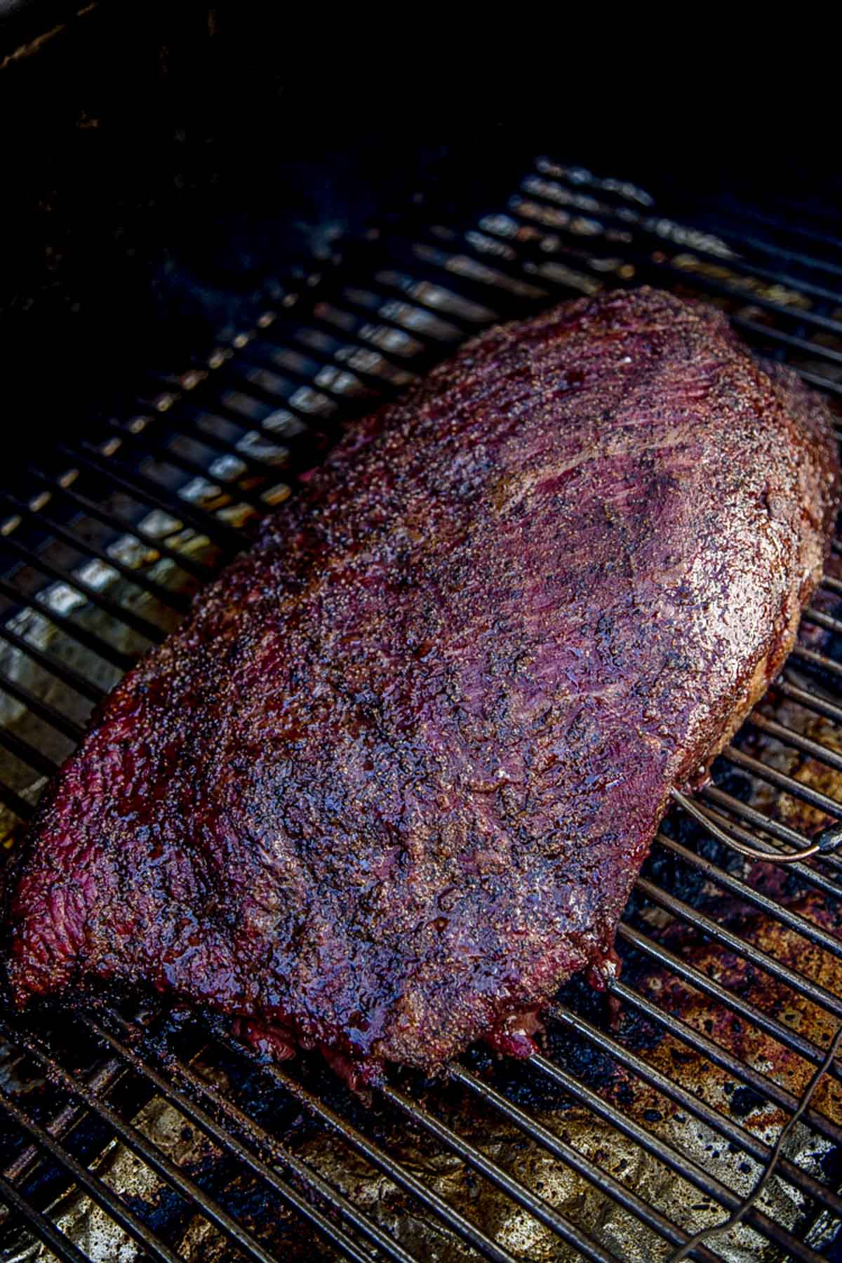 Brisket cooking on a pellet smoker