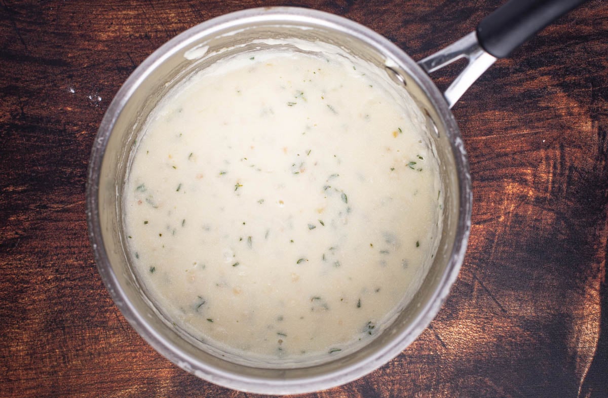 White pizza sauce in a pan.