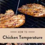 Grilled chicken breasts on the grill being with an instant read thermometer inserted into one of them