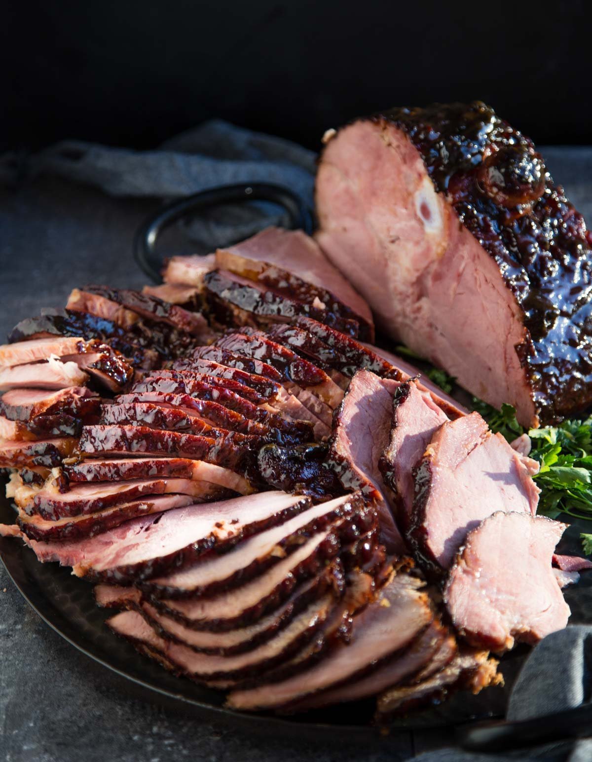 Double Smoked Ham with a Cherry Bourbon Glaze on a serving platter