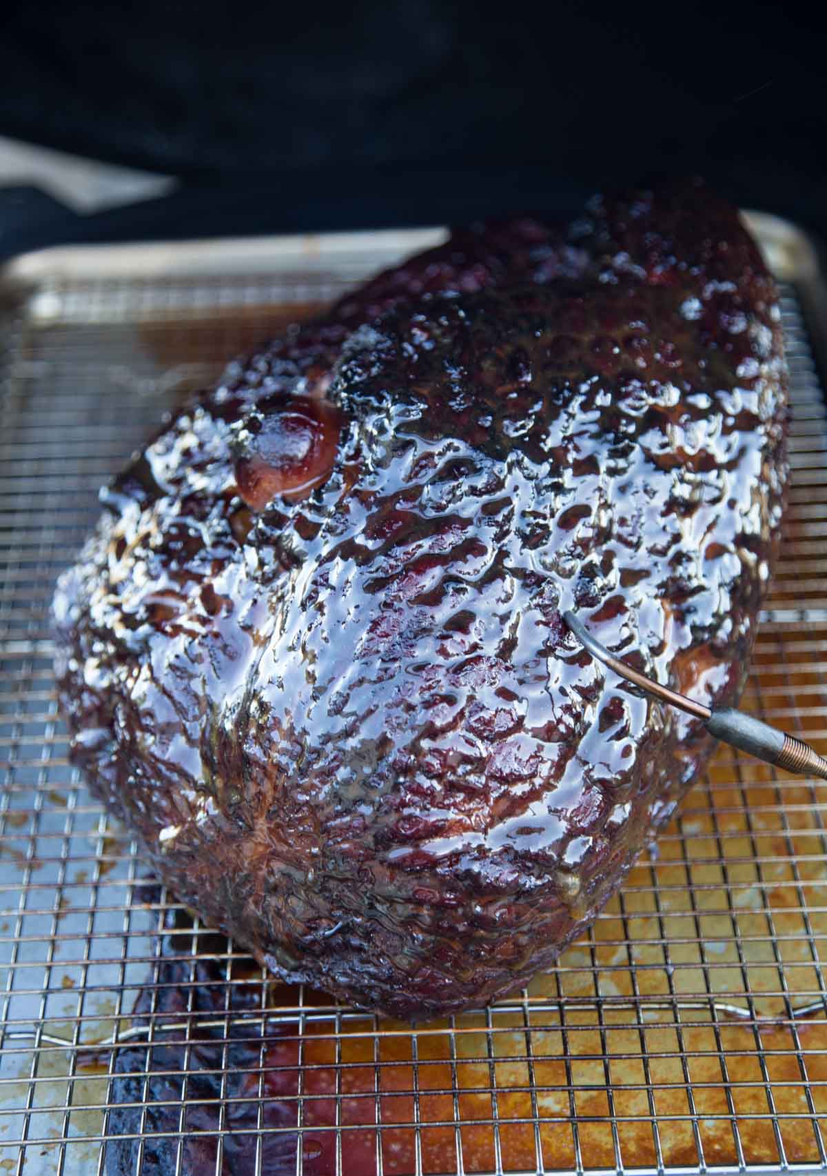 Glazed ham on a smoker