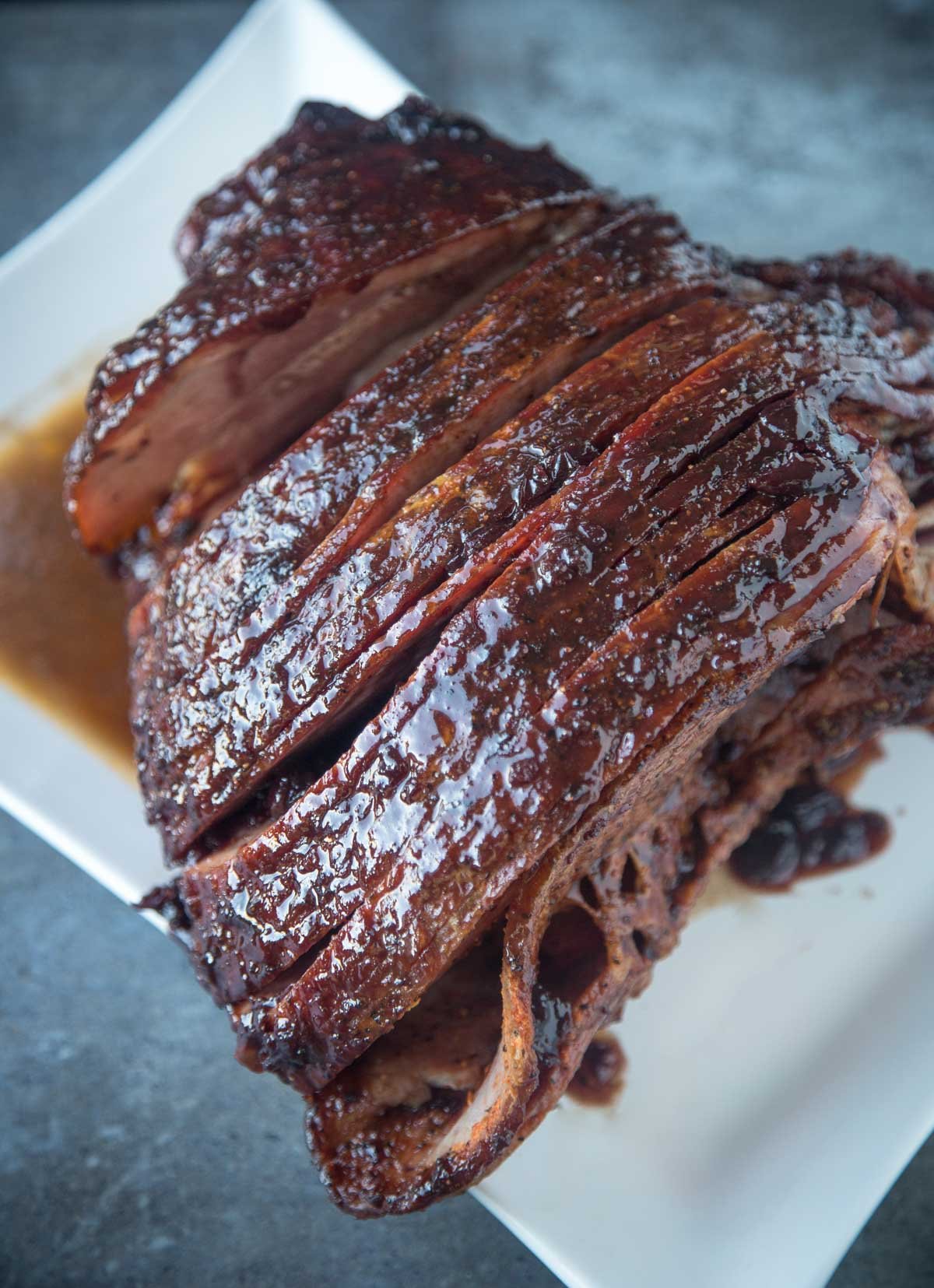 Smoked ham resting on a platter