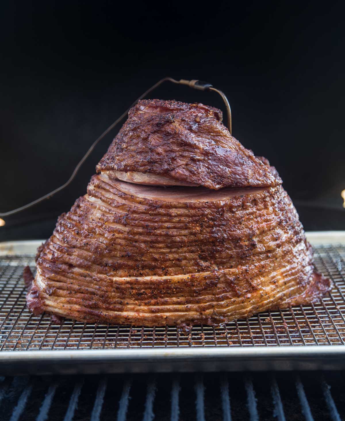 Ham cooking on a smoker