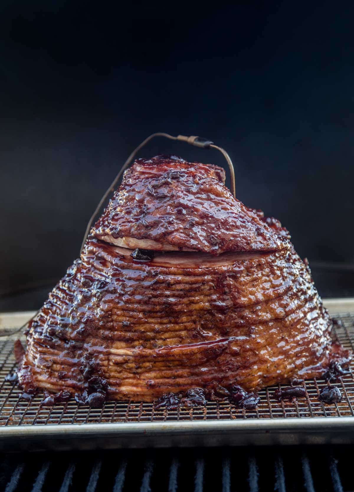 Smoked Ham with Cherry Bourbon Glaze on a smoker