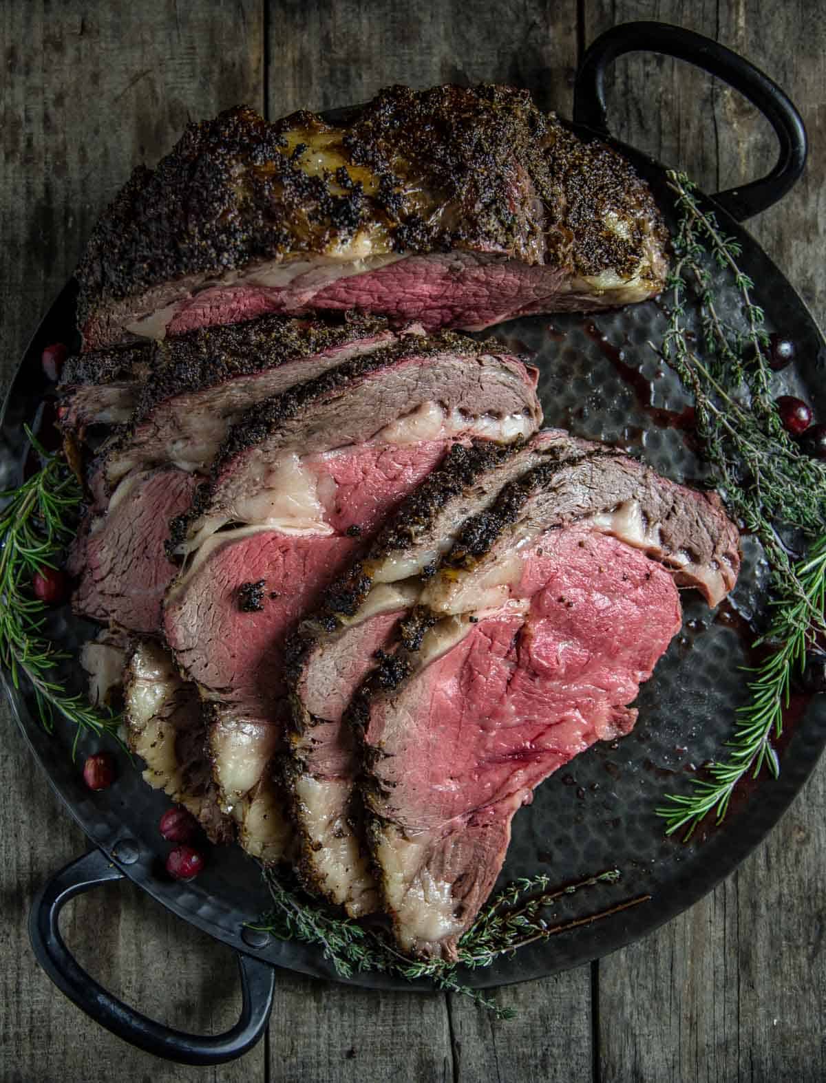 Perfect Smoked Prime Rib with Herbed Crust on a platter