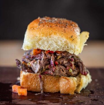 One pulled Italian beef slider on a cutting board.