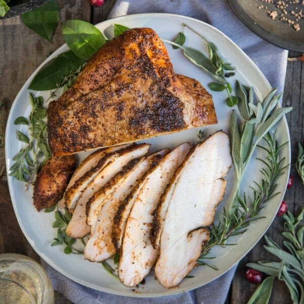 Smoked turkey breast on a plate.