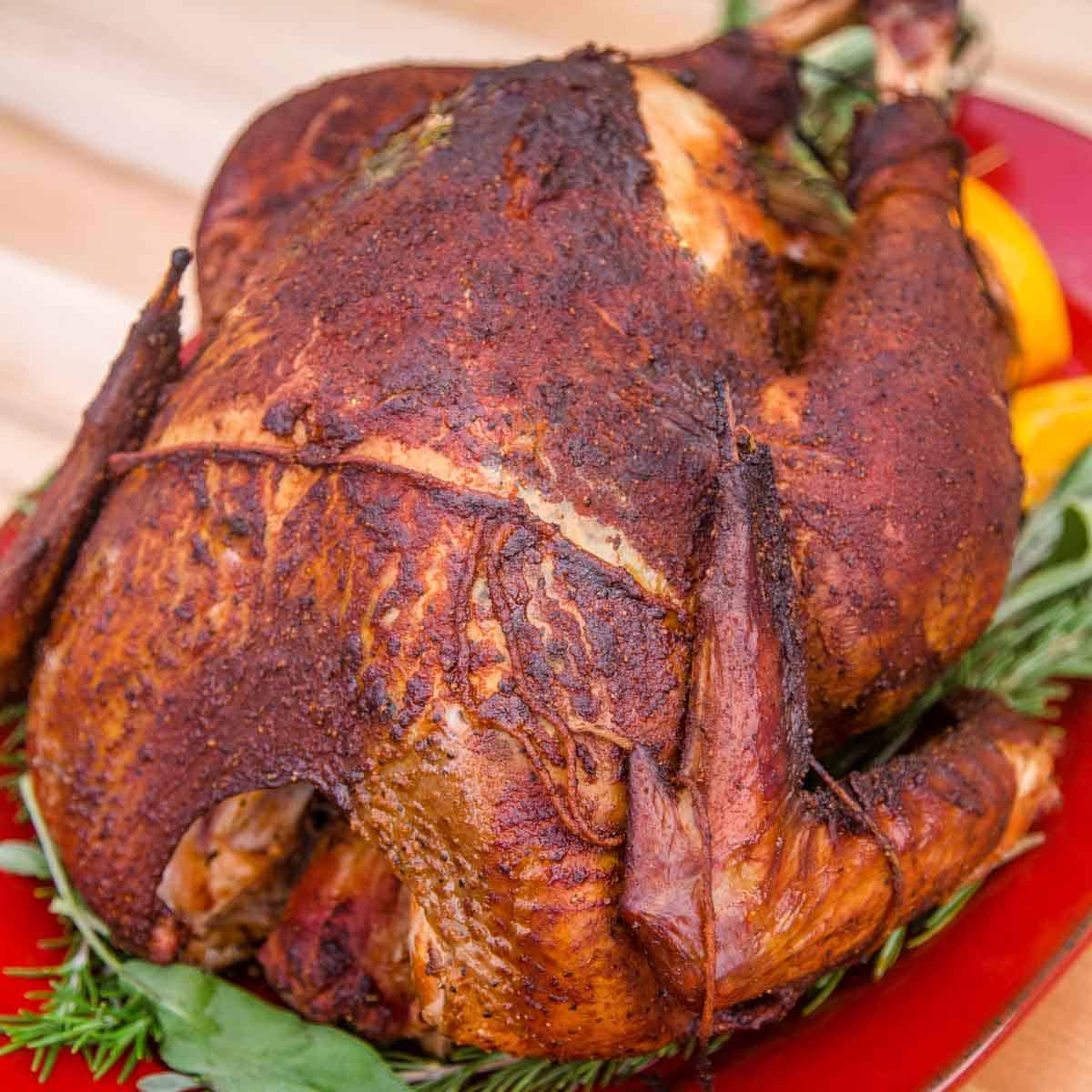 Smoked Turkey with Bourbon Brine on a serving dish