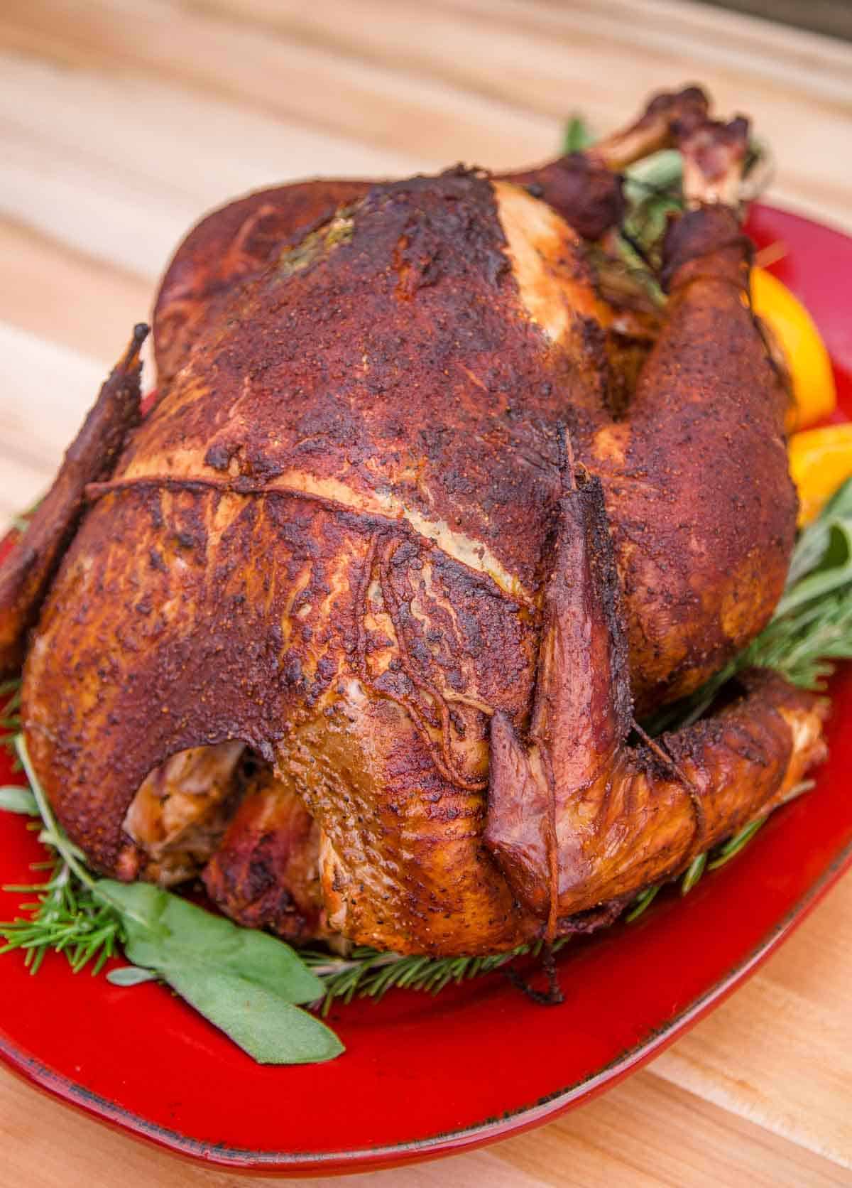 A Smoked Turkey with a Bourbon Brine on a serving platter