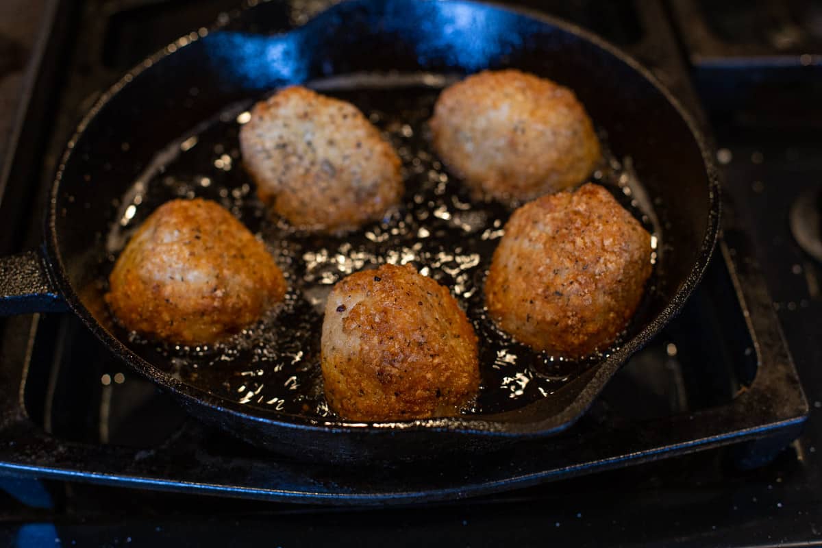 making arancini in a cast iron pan 
