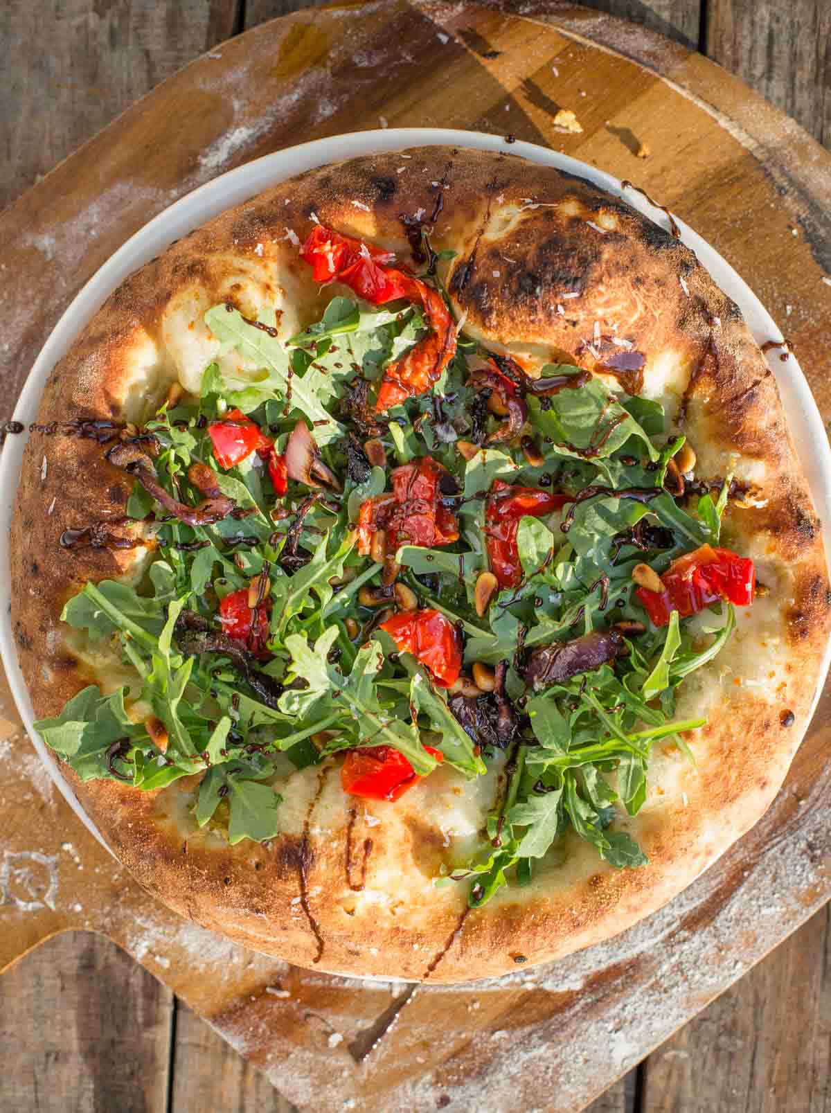 Grilled garlic pizza on a pizza peel.