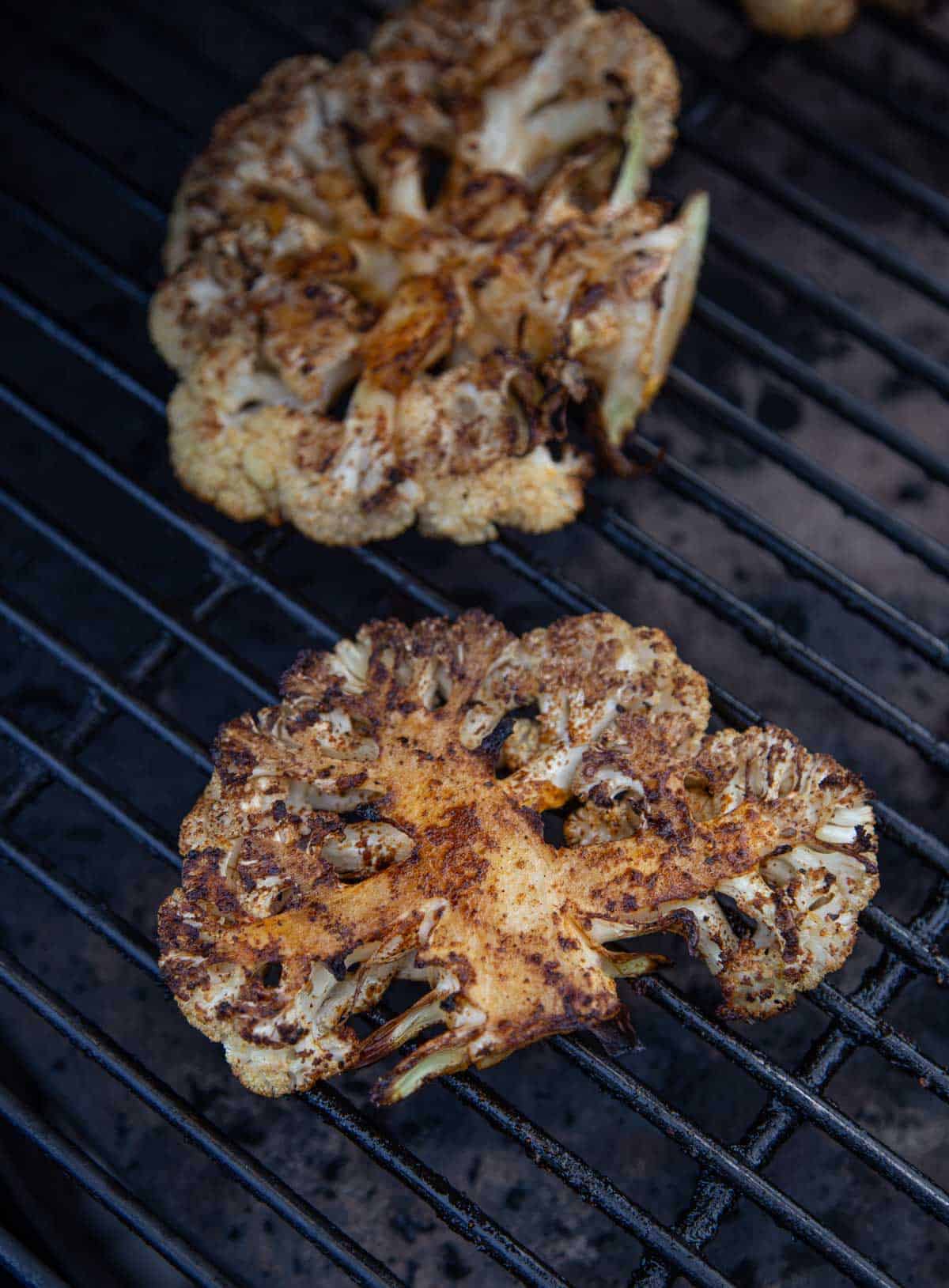 Seasoned cauliflower steaks on the Big Green Egg over indirect heat.