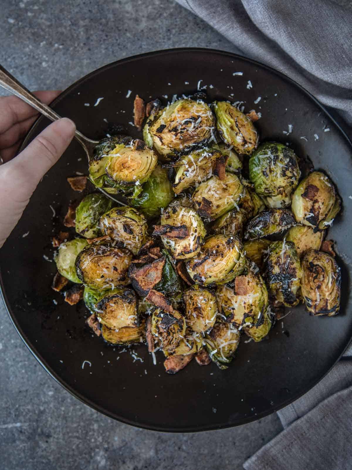 Grilled Brussels Sprouts in a serving bowl 