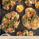 Grilled cauliflower steaks topped with chimichurri sauce and lemon juice