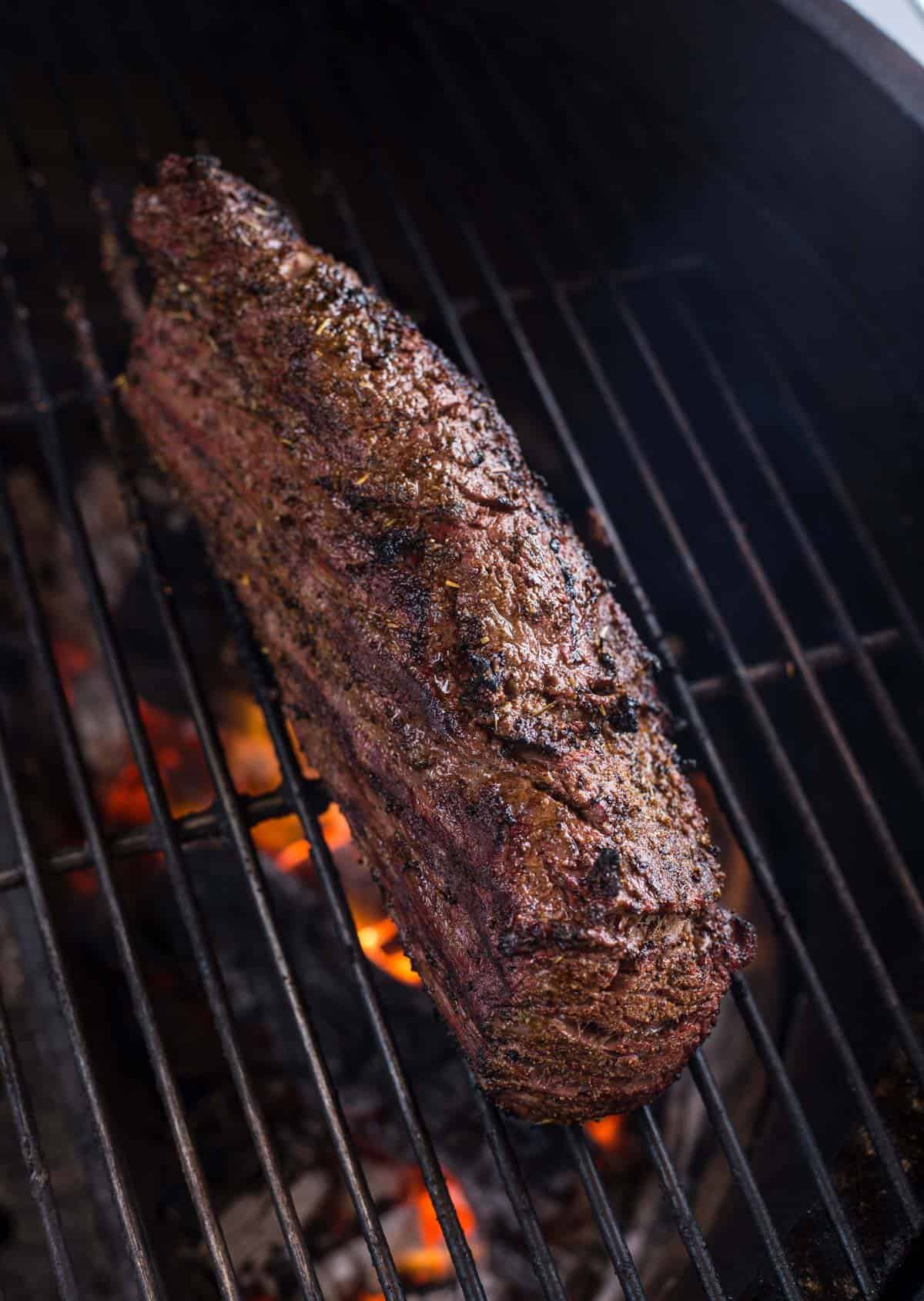 A Beef Tenderloin cooking on the grill 